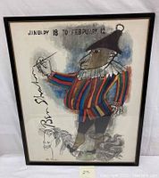 Front view of framed Ben Shahn poster showing full image of clown jester holding paintbrush with horse drawing below, signed by artist, dated 1963.