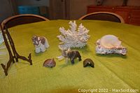Photo showing all items: white coral, sea shell on barnacle base, ornate brass photo frame stand, two elephant figurines (including one with sea shells), small jade elephant, and jade turtle missing head.