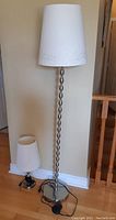Photo of both lamps side by side showing the difference in size and design