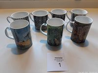 Set of seven fine bone china mugs with painted art and black/white patterned designs shown from an angle.
