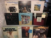Full view of 9 vinyl LP covers from Dave Brubeck Quartet and Duke Ellington showing titles and cover art.