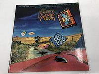 Front cover of The Album Cover Album book showing the surreal artwork and title