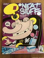 Photo of front cover of Neat Stuff comic book #14 showing graphic cartoon illustration and text details.