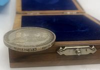 Side view of silver coin showing 'Silver 935', 'State of Israel' and '2245' stamps in English and Hebrew on the edge of the coin.
