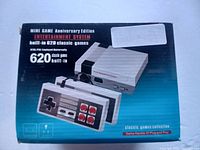 Photo of the front of the box showing the console and two controllers, marketed with 620 built-in classic games.