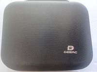 Closed black textured carrying case with Deerc logo on top