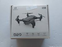 Retail box showing DEERC D20 drone image and branding.