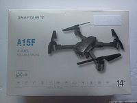 Front of the box showing the SnapTAIN A15F drone image and basic product information