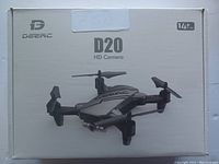 Photo of the front of the drone box showing the Deerc logo, model D20, and an image of the drone with four foldable propeller arms.