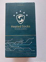 Front of box showing "Shaalek Heated Socks for winter outdoors"