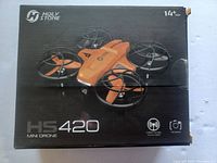 Front of the Holy Stone HS420 Mini Drone box showing drone image and features.