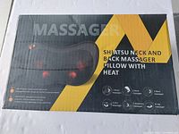 Box showing product image and highlighting features such as waist, neck, back, arm, abdomen, and leg massage capabilities.