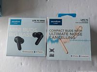 Front view of two Soundcore by Anker wireless earbuds boxes: Life P2 Mini and Life P3.