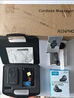 Photo showing all items in the lot: Renpho cordless massager in packaging, Electric Pulse TENS 3000 device with wires and electrode pads in case, smartwatch with charging cable in box, SoundCore Life A1 earbuds retail box.