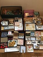 Overview of multiple boxes containing bracelets, necklaces and earrings