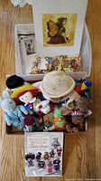 Lot overview showing plush toys, fairy figurines, the teddy bear making book, and art print