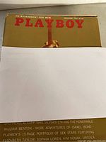 Top cover of December 1965 Playboy magazine, gold cover with red text and classic design.