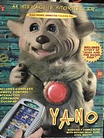 Front of box featuring character Yano, stating features such as animated talking pal, story of Jana and the Magic Fish, and remote control interactive storybook touchpad.