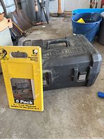 Yellow cardboard saw blade packaging labeled '5 Pack 7-1/4 inch Plywood Blades' by Osborn brand, front view with blades visible.