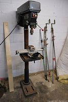Full view of floor drill press including base, column, head and worktable