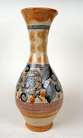 Full view of hand-painted vase showcasing floral design and colors.