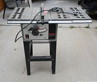 Full view of Shopcraft 10" table saw on metal stand with power cord and adjustable fence.