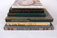Stack of 6 vintage fiction books showing titles and varying cover materials including cloth and paper.