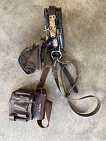 Front view of the Klein lineman belt with attached tool belt and pouches showing leather condition and hardware.
