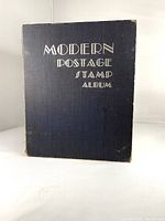 Front cover of navy textured hardcover album with white title text