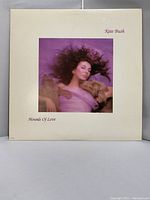 Front cover of the LP featuring Kate Bush's image and album title "Hounds Of Love"