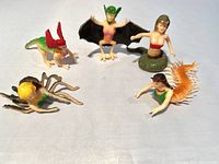 Photo showing all five rubber Monster Women figures arranged on a white surface, displaying various fantasy creature designs.