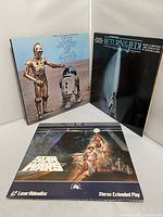 Photo of the three items showing Star Wars LPs and Laser Videodisc with their covers visible.