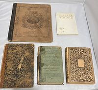 Lot overview showing five old books with visible age wear, loose bindings, and separated covers, arranged on white background.
