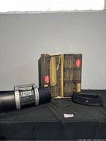 Photo showing the RCA DVD player box next to the radio/CD player and JBL speaker dock on floor.