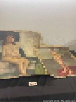 Two vintage nude paintings on canvas shown lying flat with visible wear and wear edges