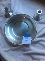 Photo showing the sterling silver tray with two candlesticks on a white cloth background, with tag number 96.