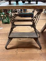 Front view of Black & Decker Workmate folding work table showing the wooden top and metal frame with logos.