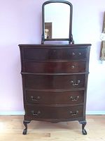 Front view of antique highboy dresser with five drawers and attached mirror frame (mirror separate)