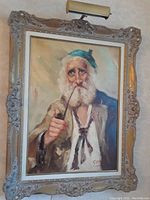 Framed oil on board painting showing elderly man with beard and pipe, signed 'Gore'.