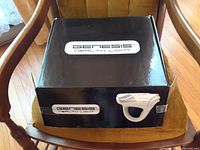 Closed black box labeled GENESIS HEALTH LIGHT