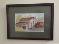Full view of the watercolor painting framed, showing a rural building with red roofs and green surroundings.