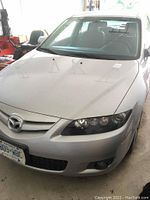 Front view showing hood, grille, headlights