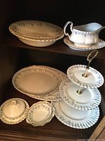 Multiple Royal Albert Memory Lane china pieces including oval serving bowls, gravy boat with plate, round platters, three-tier stand, butter dish with lid, and relish bowls