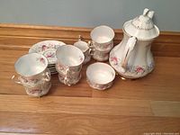 Full set of Royal Standard China tea set pieces including teapot, 6 cups, 6 saucers, creamer, and sugar bowl displayed on wooden surface
