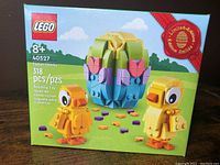Front of the Lego box showing the Easter Chicks set 40527 with 318 pieces, age recommendation 8+, limited edition badge, and colorful Easter egg and chick models.