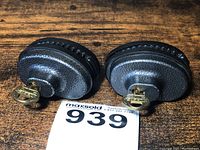Top front view of two Masterlock trigger locks with keys inserted, showing the textured gray metal body and key details.