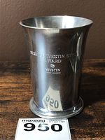 Full view of a four inch pewter cup with engraving and MaxSold lot number 950.