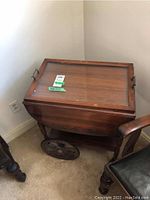 Full view of tea cart showing top with removable tray and large wheels