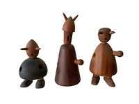 Three wooden Viking figurines shown from front on white background, stylistic handcrafted design with horns and minimal features