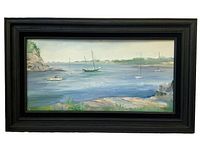 Front view of the framed oil painting of a harbor scene with sailboats and rocky shoreline by Peg Lannefeld.